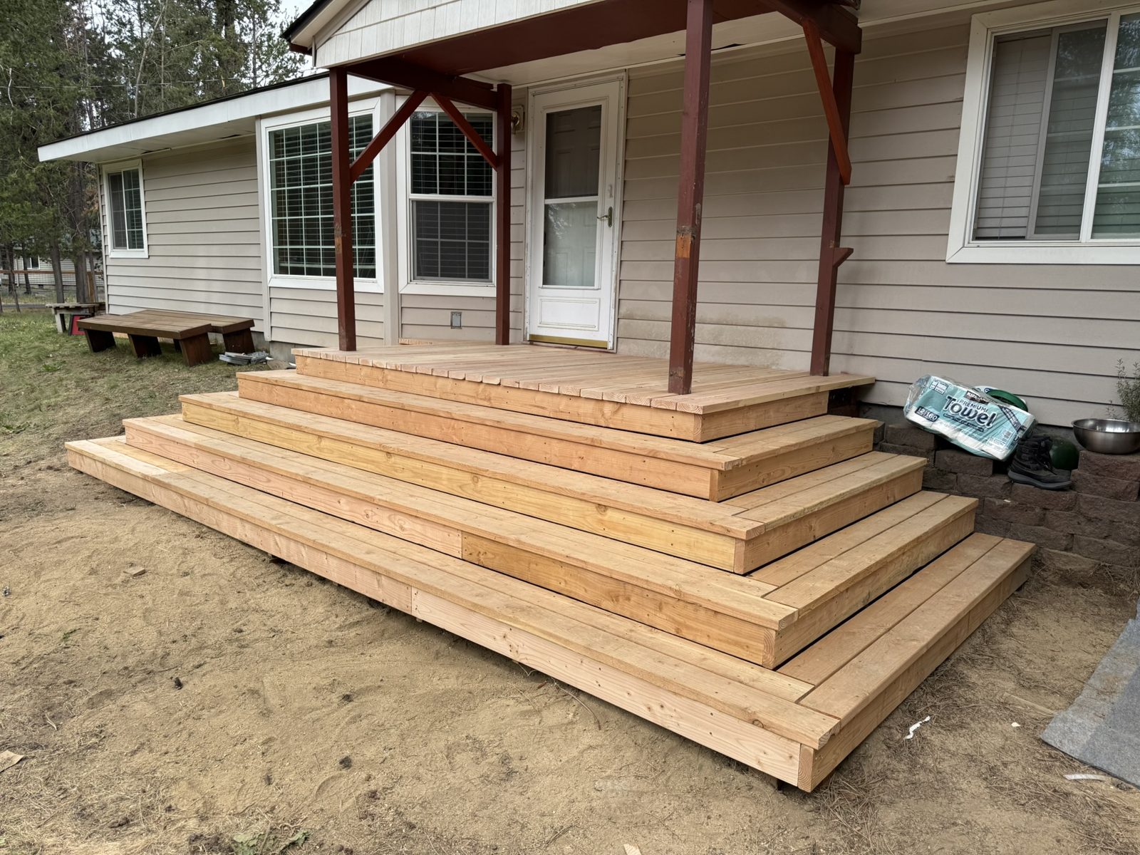 Ground-level wood deck blending into the landscape